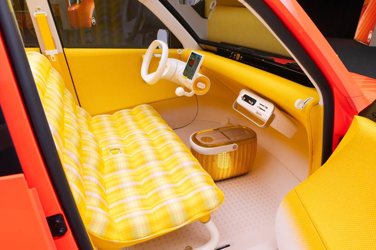 Interior of the Citroën 2CV electric concept with yellow check bench seat