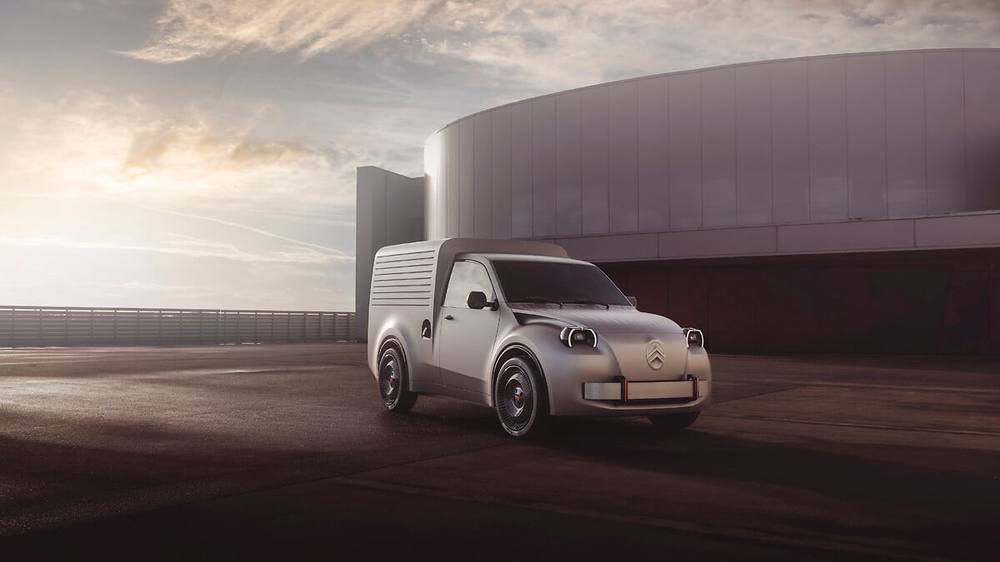 Citroën 2 CV Fourgonnette Concept parked in front of a modern building