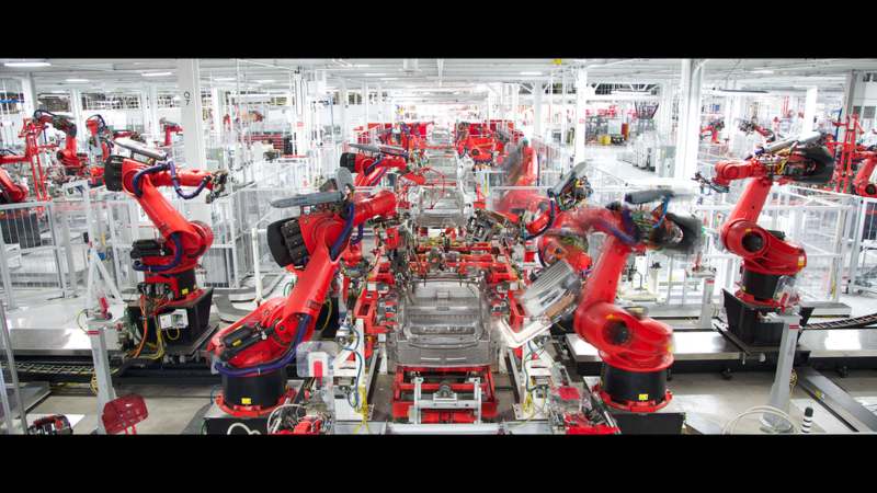 Tesla robots assembling car bodies at Giga Berlin