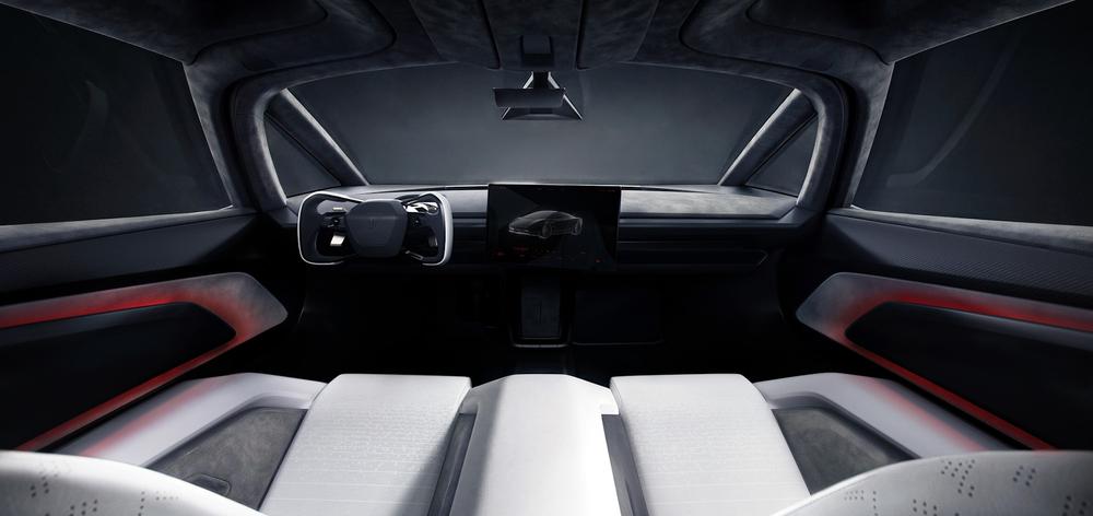White Tesla Roadster interior with a yoke, center screen and two small forward displays