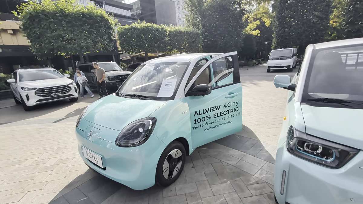 Blue Moon Allview 4City electric car seen from the front at an outdoor motor show
