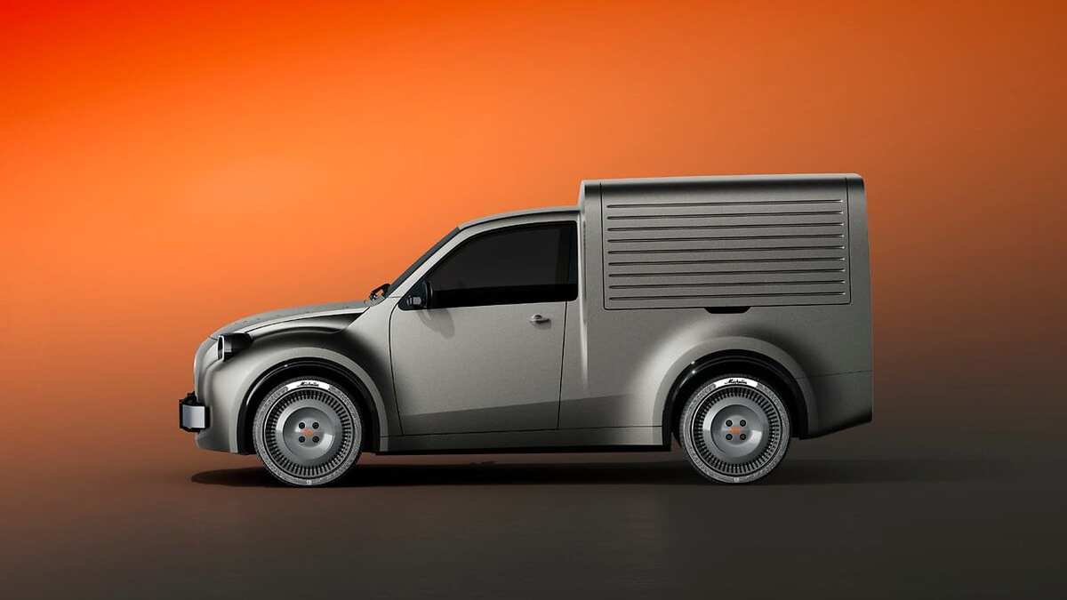 Grey Citroën 2 CV Fourgonnette Concept, side view against an orange studio background