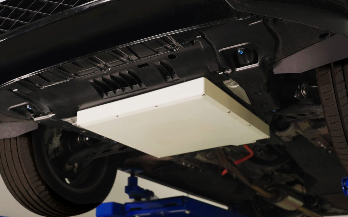 Concept image of a vehicle with a VA (Vehicle Assembly) unit for in-motion wireless charging, from the Honda–Taisei announcement