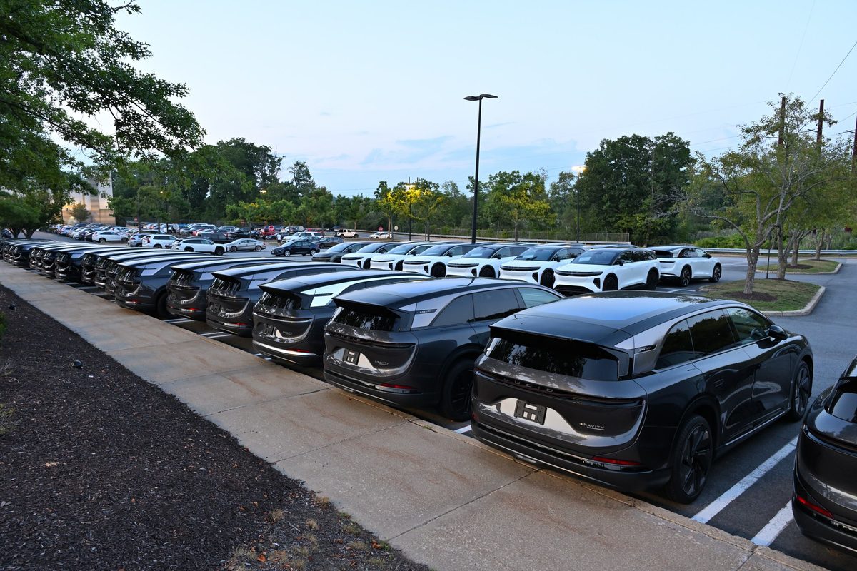 Rows of black and white Lucid Gravity SUVs in a parking lot in Framingham, Massachusetts, August 2026