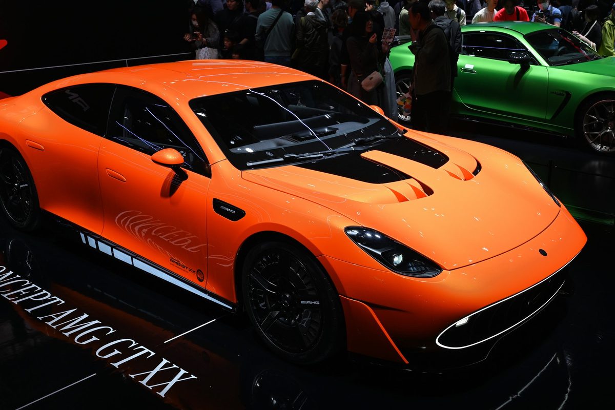 The orange Mercedes-AMG Concept AMG GT XX prototype on display at a motor show