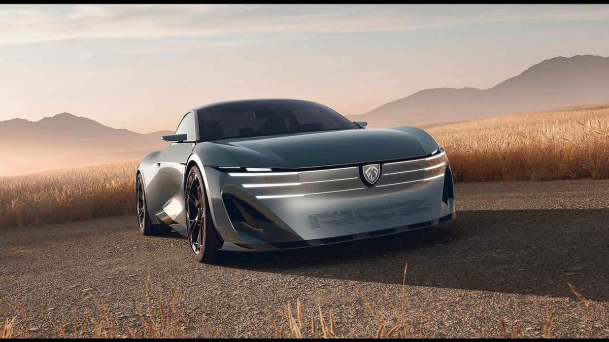 Grey Peugeot RCZ Vision on a country road at sunset, front view