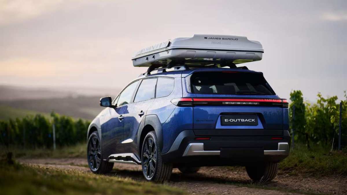 Subaru E-Outback electric with a roof tent, seen from the rear