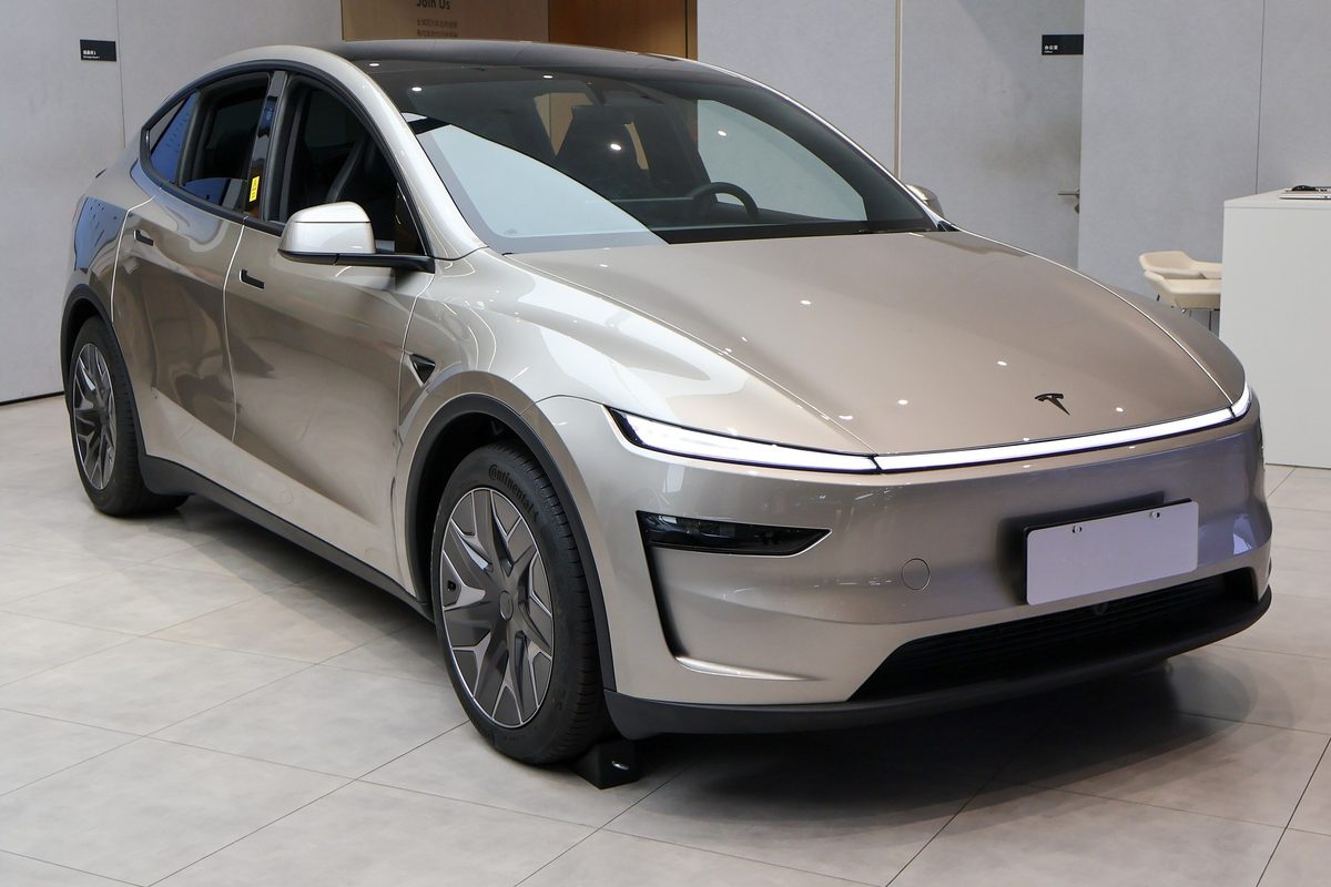 Silver-gold Tesla Model Y L on display in a Tesla showroom in Shanghai