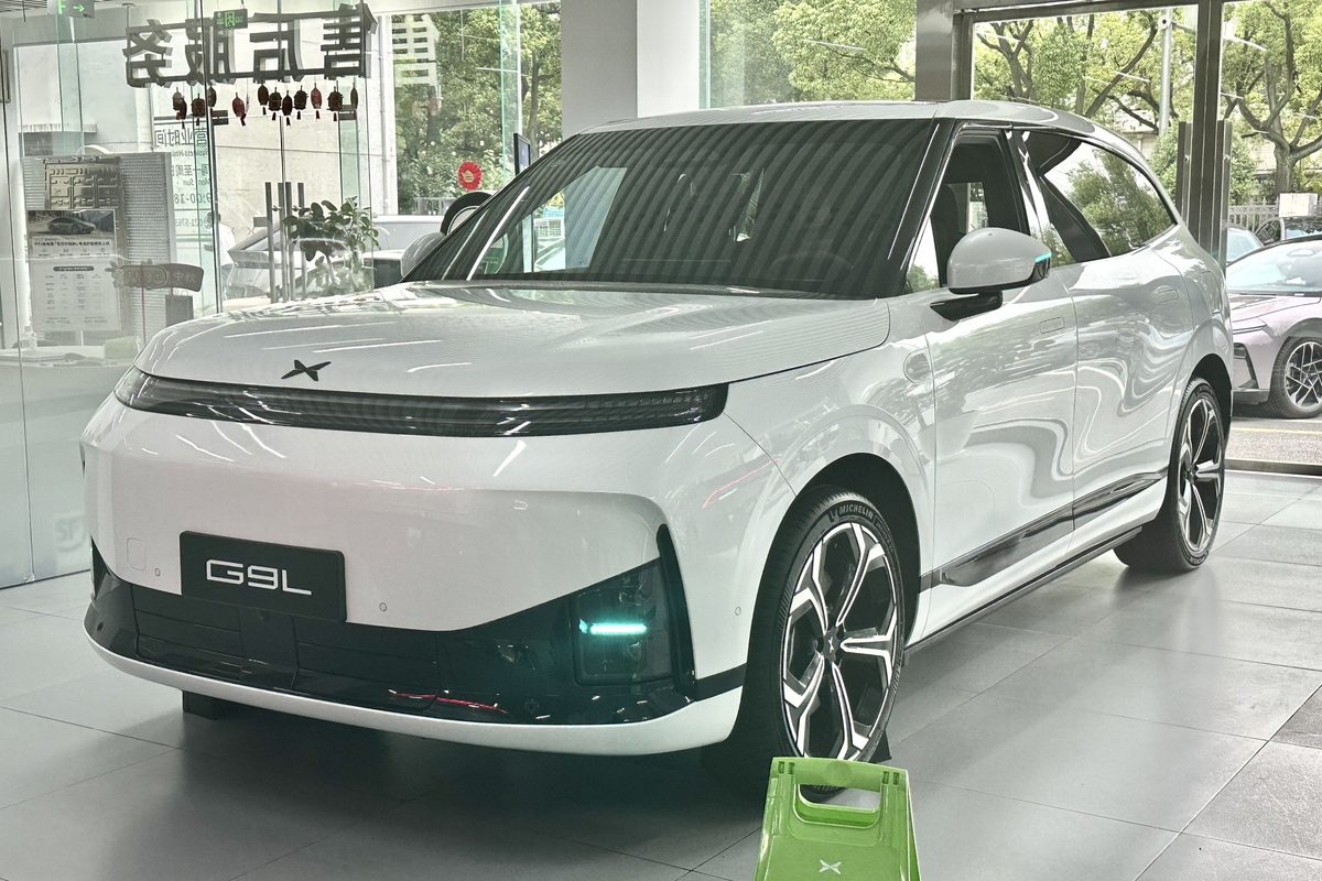 White Xpeng G9L electric SUV displayed in a showroom in China